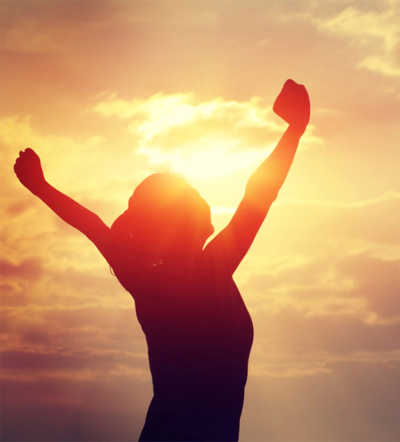 woman-happy-with-sunset-in-background